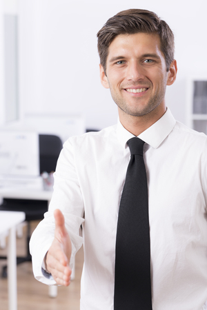 Young man with a welcome hand