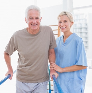 Smiling physical therapist with patient